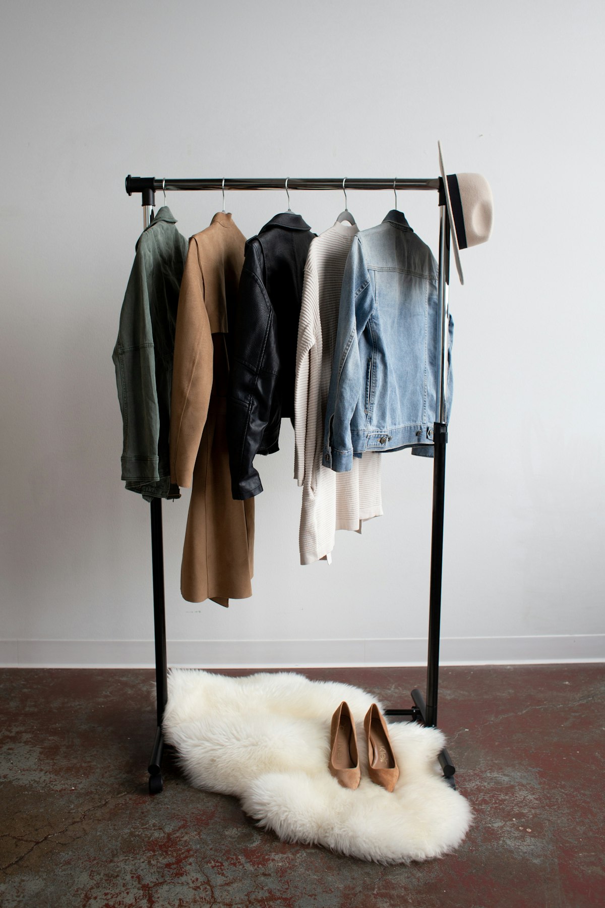 Curated boutique clothing rack with jackets and accessories